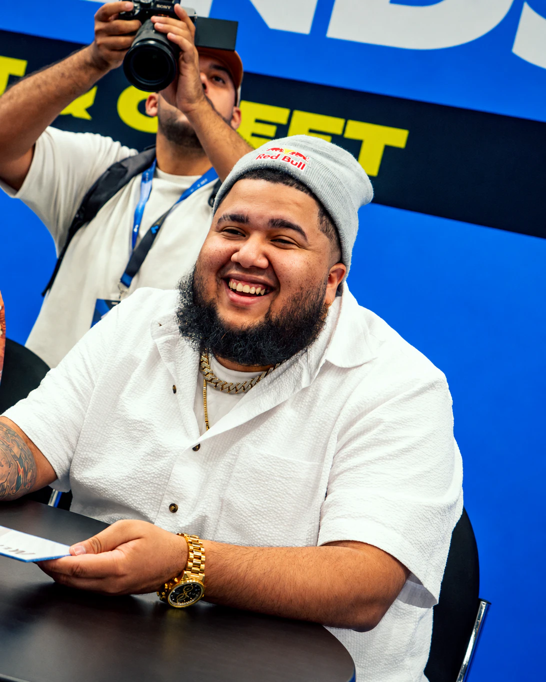 MenaRD smiling at a fighting game community event