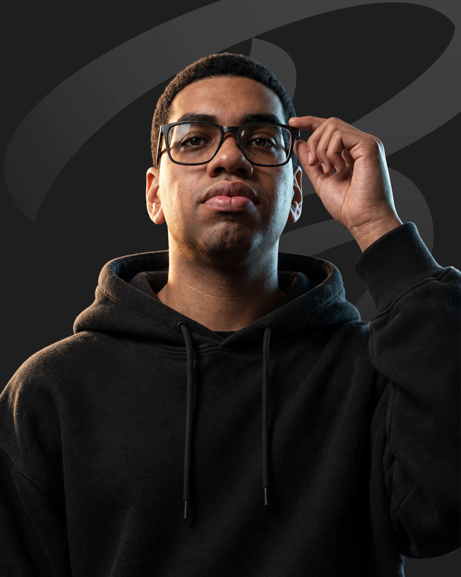 Noah The Prodigy wearing a black hoodie and adjusting his glasses against the Bandits portrait background